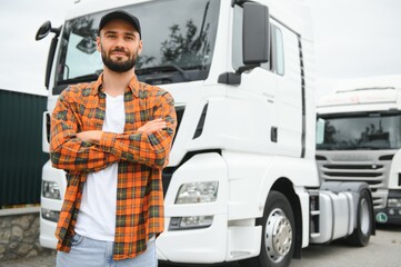 Portrait of confident truck driver on parking lot. Copy space