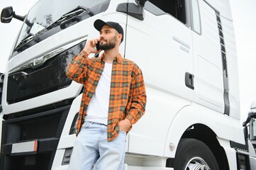 Men driver near lorry truck. Man owner truck driver near truck. Man trucker trucking owner....