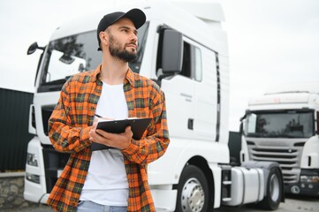 Men driver near lorry truck. Man owner truck driver near truck. Man trucker trucking owner. Transportation industry vehicles. Handsome man driver front of truck.