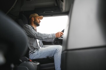 Truck driver sitting in cab