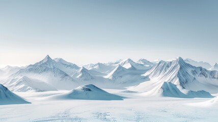 Pristine snowy mountain landscape - A breathtaking panoramic view of snow-covered mountains under a clear blue sky evoking solitude