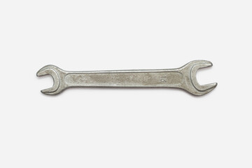 Wrench isolated on a horizontal white background. One hand tool top view with space for text, no...