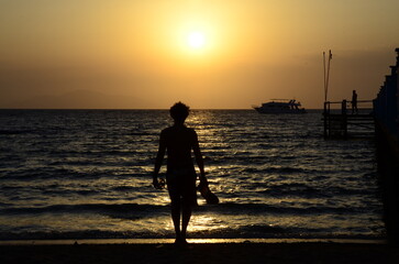 silhouette of a man against the background of the sea