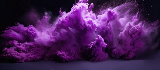 A cumulus cloud of electric blue and magenta hues rises from the ground, creating a striking contrast with the purple sky - obrazy, fototapety, plakaty