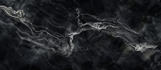 A striking black marble texture with white lines resembling flowing liquid on a dark background, creating a beautiful contrast reminiscent of a windy day by the water