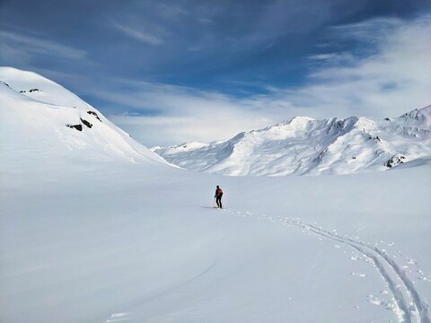Ski tour through the fresh powder snow. Traces through the deep snow in the mountains of Davos Klosters Mountains. Skitour  in Switzerland. High quality photo