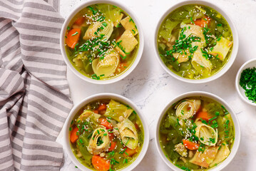 Cabbage soup with eggs roll in a ceramic bowl on a table.  .style hugge