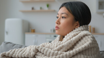 Depressed upset lonely Asian woman look in side think suffer apathy sadness depression alone...