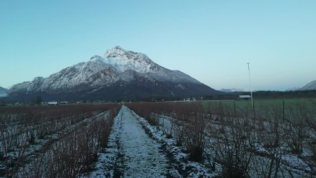 Scenic drone footage of the snowcapped Untersberg Mountain in Salzburg, Austria. Shot via drone in 4k at both sunrise and sunset. Along with the small town at the bottom of the mountain.