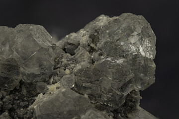 Cluster of translucent grey celestine crystals with natural rough matrix