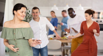 Fototapeta premium Dance moves of men and woman of different nationalities at a fun holiday party at home