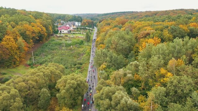 A group of bicycle spotters compete against each other in a bicycle race. Bicycle race among professional athletes in mountainous terrain. Bicycle races against the background of a beautiful mountain
