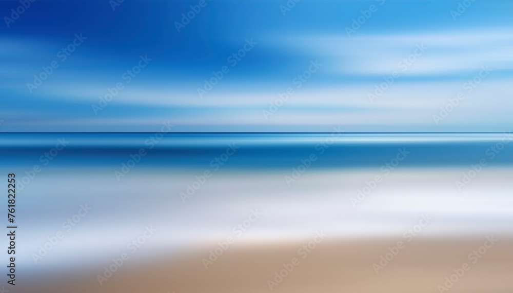Poster a motion blurry image of a beach with a blue sky in the background. the water is calm and the sky is
