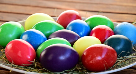 Colorful boiled easter eggs on a wooden table	