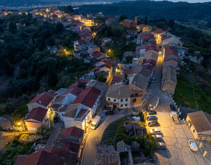 Aerial drone view of traditional Agrafi village in north corfu, Greece by night