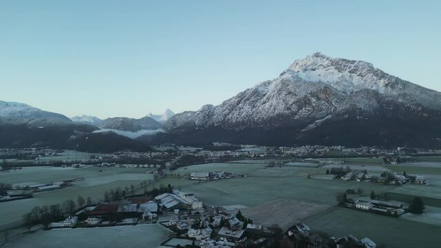 Scenic drone footage of the snowcapped Untersberg Mountain in Salzburg, Austria. Shot via drone in 4k at both sunrise and sunset. Along with the small town at the bottom of the mountain.