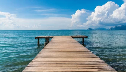Poster Im Rahmen wooden pier with blue sea and sky background © Nichole