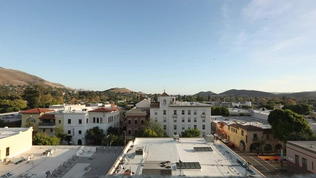 San Luis Obispo, California, USA - December 3, 2021: Aerial view of afternoon light shining on the historic buildings of the downtown core.