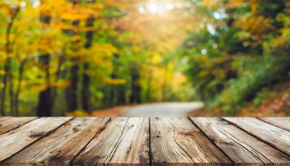 Naklejka na ściany i meble the empty rustic wooden table for product display with blur background of autumn forest exuberant image