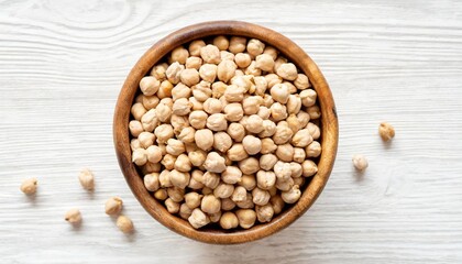 dry raw organic chickpeas in wooden bowl isolated on white background top view