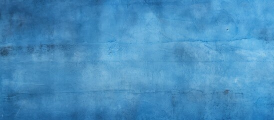An electric blue wall with a grunge texture, showcasing a unique pattern of tints and shades. The font and symmetry add to its striking visual impact - obrazy, fototapety, plakaty
