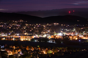 Beautiful elevated twilight sunset view of the evening lights of downtown San Luis Obispo, California, USA.