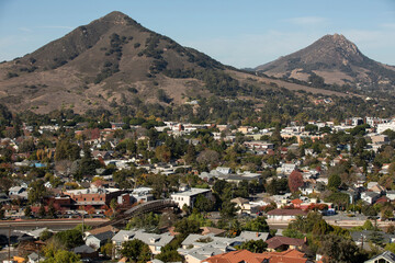 Fototapeta na wymiar San Luis Obispo, California, USA - December 3, 2021: Aerial view of afternoon light shining on the historic buildings of the downtown core.