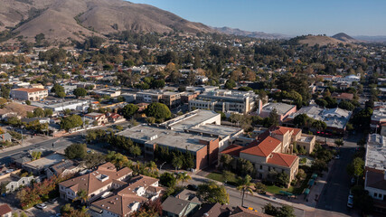 San Luis Obispo, California, USA - December 3, 2021: Aerial view of afternoon light shining on the historic buildings of the downtown core.