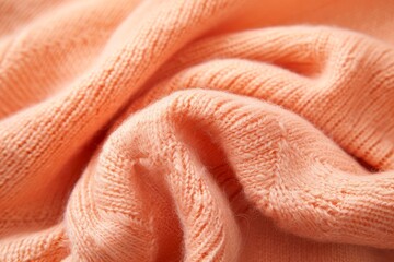 Closeup of cashmere sweater in light orange