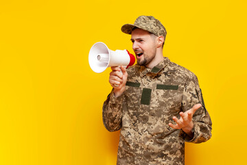 Ukrainian army soldier in pixel military camouflage uniform announces information into a megaphone...