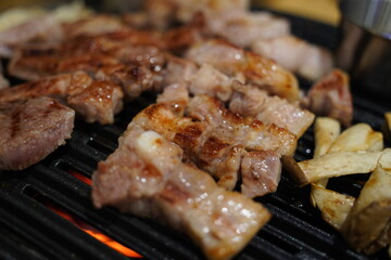 Grilled pork belly on the grill in the restaurant