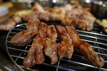Grilled pork belly on the grill in the restaurant