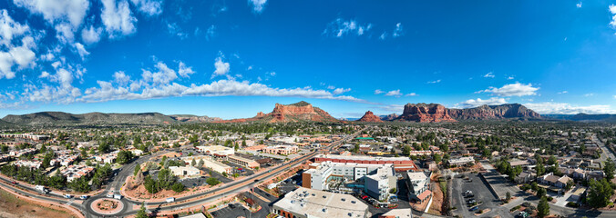Sedona, Arizona, looking at the Southern area of the Valley Shopping Areas and the Red stone Buttes from a  UAV Drone - obrazy, fototapety, plakaty
