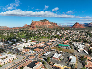 Sedona, Arizona, looking at the Southern area of the Valley Shopping Areas and the Red stone Buttes from a  UAV Drone - obrazy, fototapety, plakaty