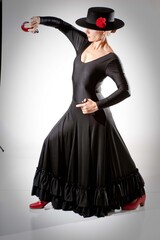Flamenco dancer with castanets and cordobes hat isolated on white background.