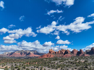 Sedona, Arizona Area Landscape on a Partly Cloudy day with parts of the Red Rock Park and a Blue Sky