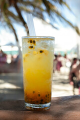 Coastal Cocktail: Tropical Drink with blurred Beach Background