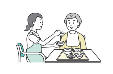 食事介助をする介護士と高齢女性のイラスト