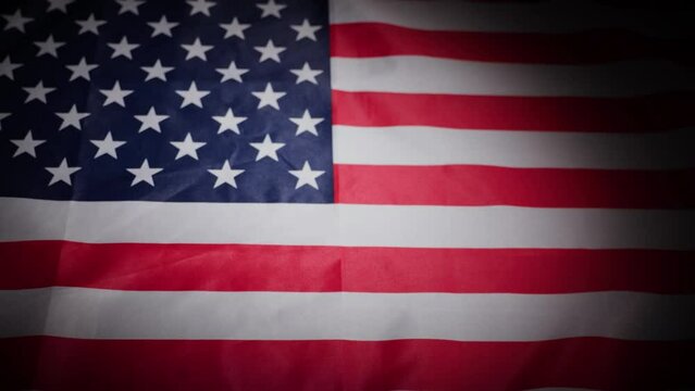 Rack focus of United States USA national flag with vignette