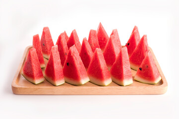 Slices of watermelon on wooden tray on white background - 761889606