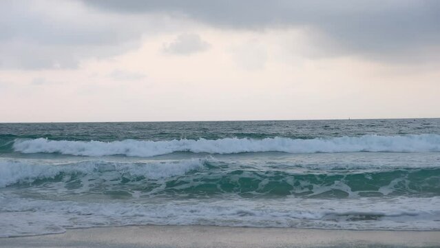 waves of the ocean and cloudy in beginning rainy season.
