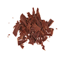 Many delicious chocolate shavings isolated on white, top view