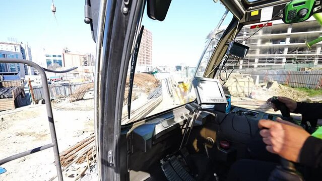 Operator carries rebar using a crane in Istanbul