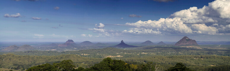Expansive panorama captures Queensland's majestic Glasshouse Mountains, a natural wonderland of rugged beauty, Australia