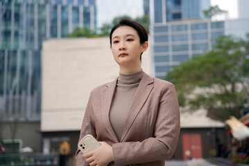 Confident Young Woman in Business Attire Downtown