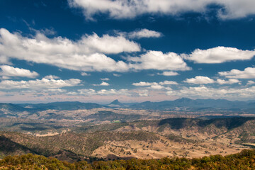 Naklejka premium ck Creek Road winds through South East Queensland, offering breathtaking vistas of lush landscapes and rolling hills. Explore scenic beauty and serenity