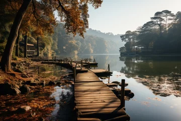 Photo sur Plexiglas Réflexion Wooden dock on tranquil lake amidst forest with water reflecting sky