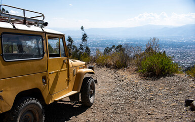 Offroad vehicle overlooking mountains