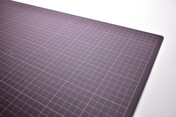 black cutting mat board on white background with line and scale measure guide pattern for object...