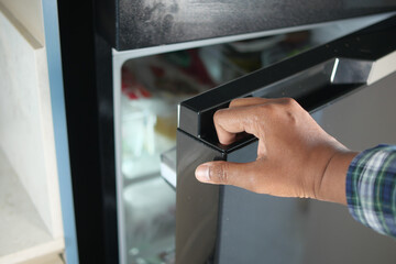 Obraz premium half open fridge with food and vegetables ,